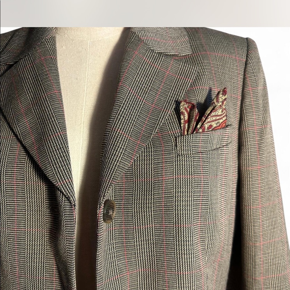 Plaid blazer with pocket square detail.
